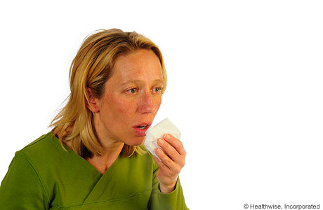 A person coughing to loosen mucus