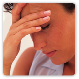 Photo of a woman with her hand to her head